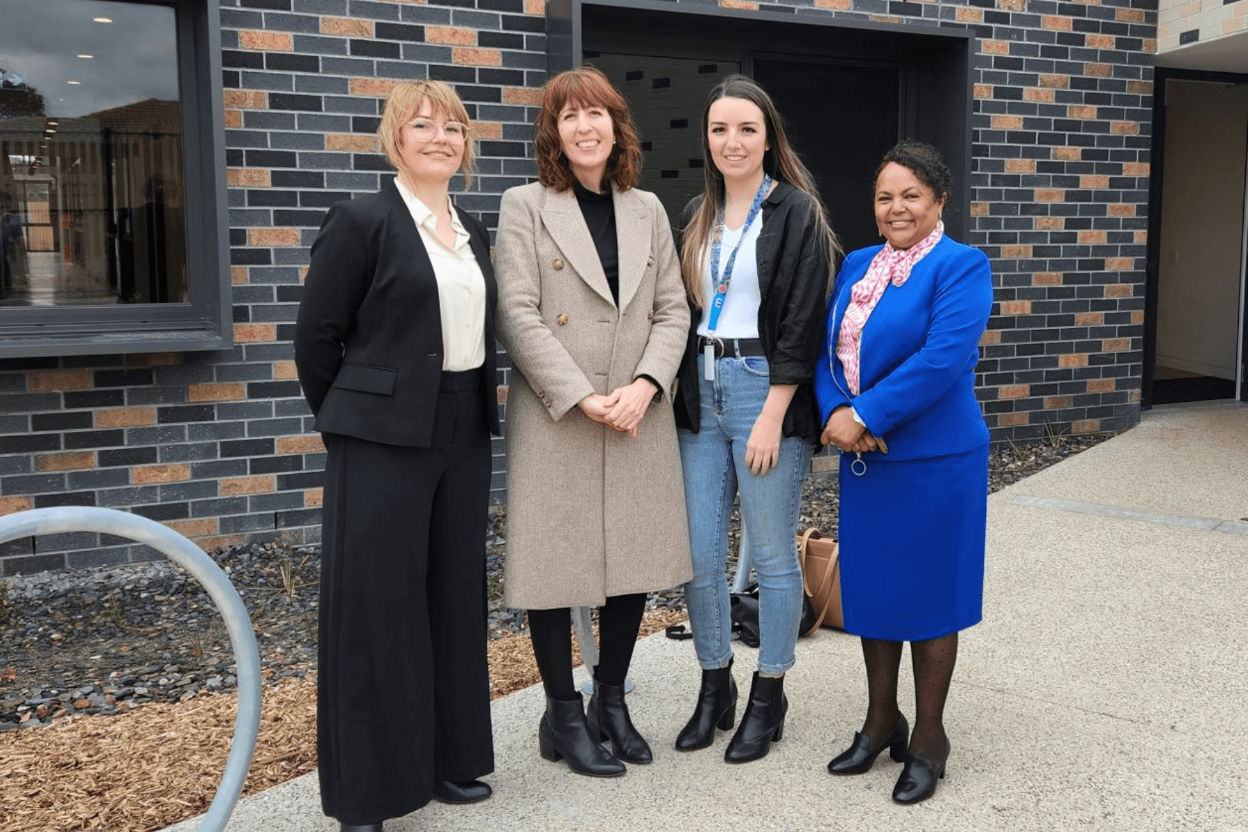 Four-people-standing-together-outside