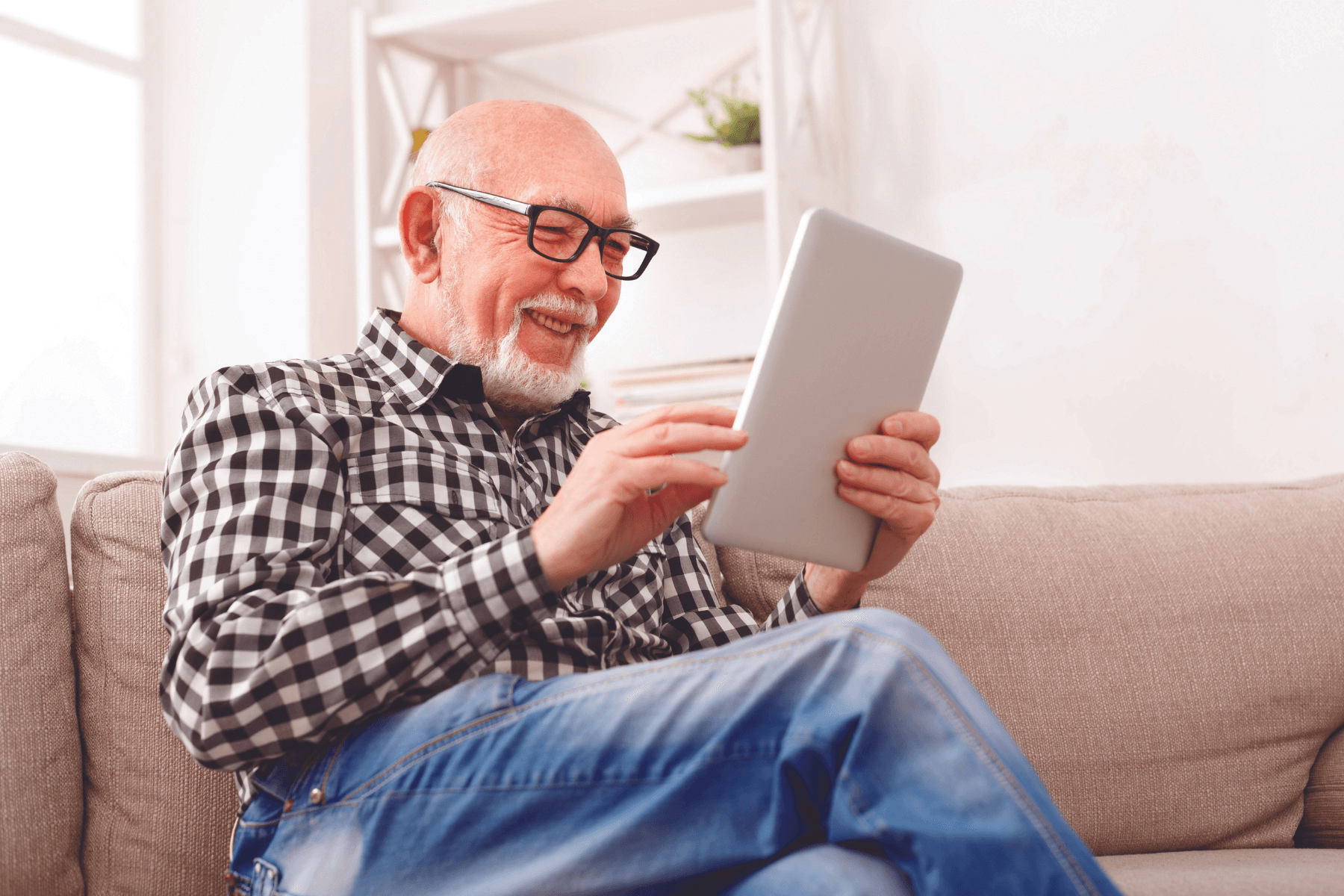 older-man-wearing-glasses-with-ipad